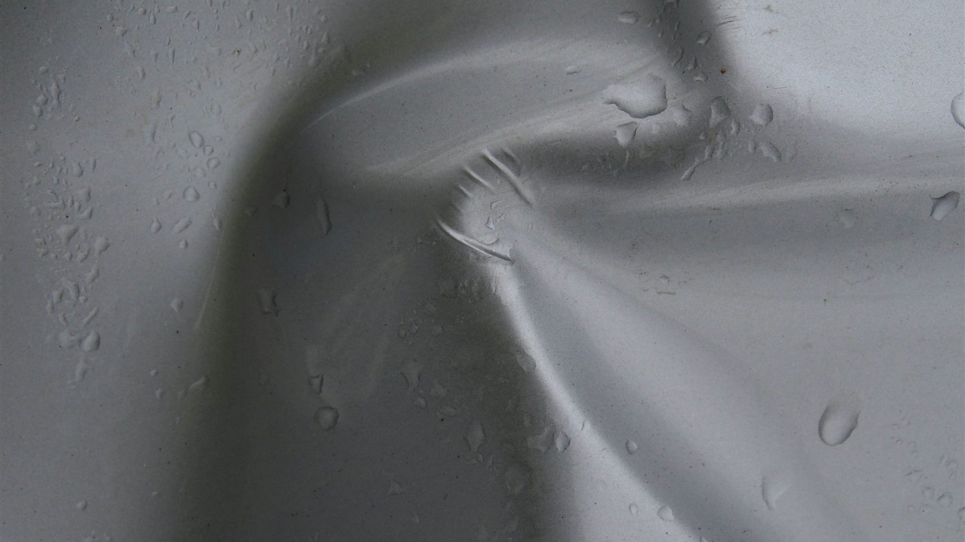 Water droplets beaded on a water-repellent surface